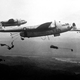 Paratroopers of the 187th Airborne Regimental Combat Team jump out of U.S. Air Force Fairchild C-119 Flying Boxcars over Korea in 1950.